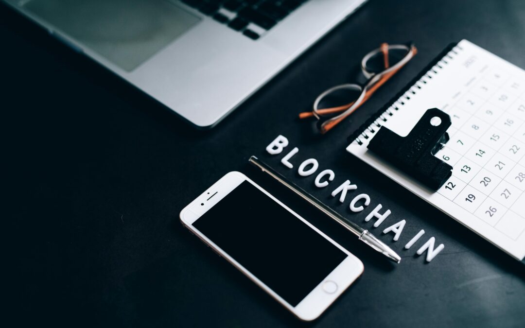 Free Flat lay of a modern digital workspace with blockchain theme, featuring a smartphone and calendar. Stock Photo